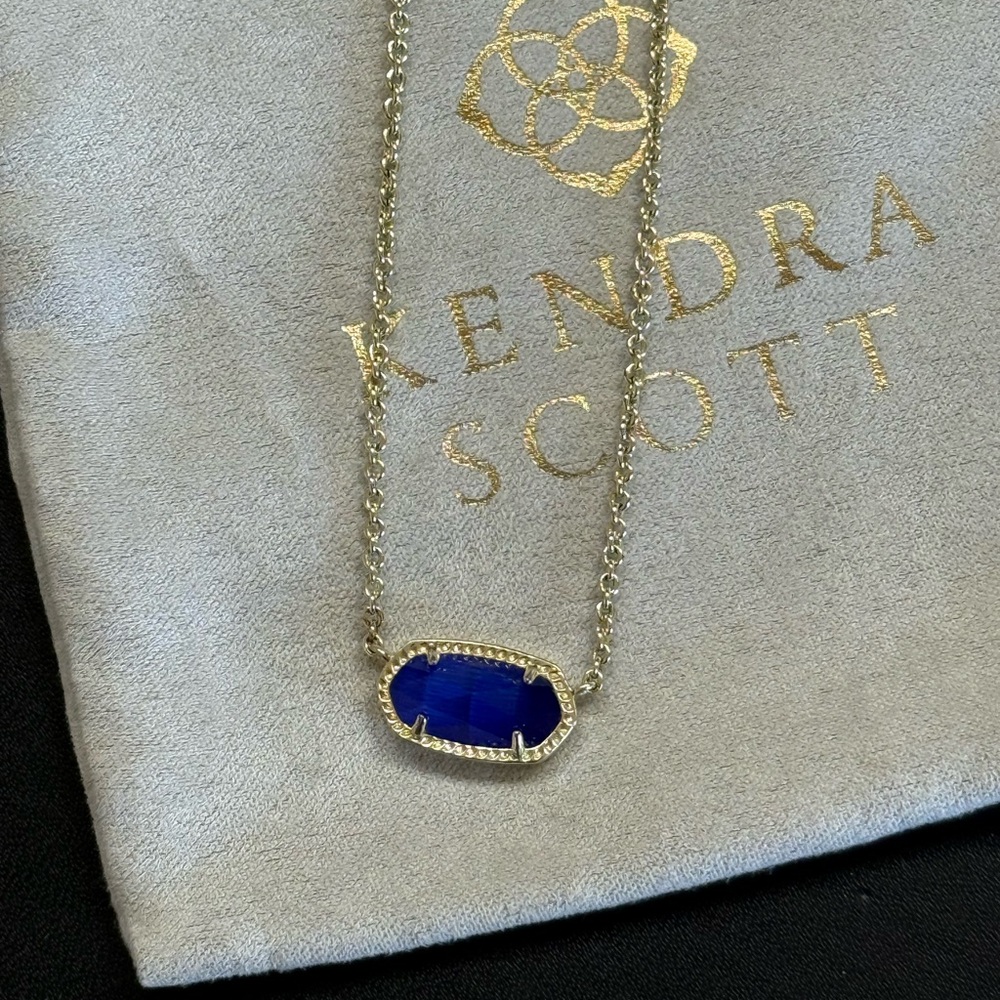 Kendra Scott Elisa Gold Pendant Necklace in cobalt blue catseye glass